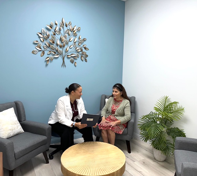 Dr. Talley speaking with a patient during an unhurried consultation in her North Las Vegas office